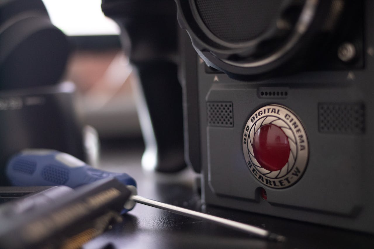 Detailed close-up of a RED Digital Cinema Scarlet-W camera, perfect for video production themes.