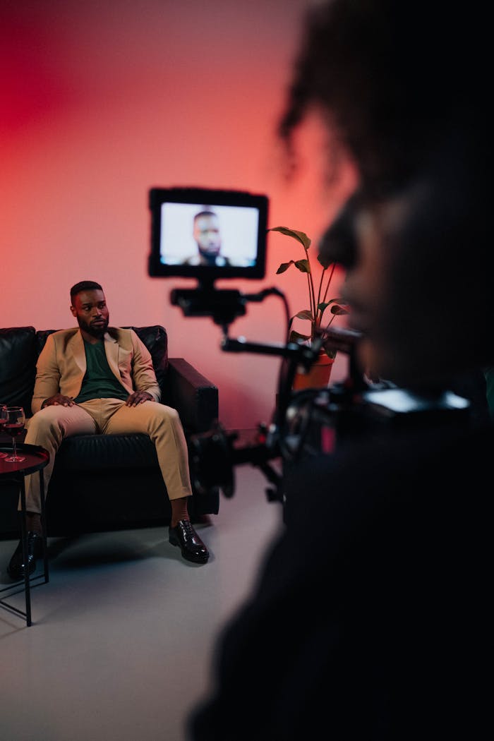 Capturing a professional film shoot with actor on set indoors.